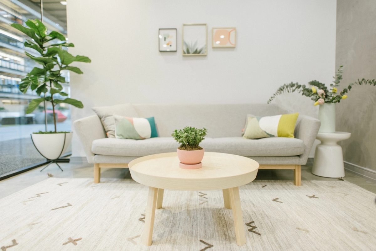 Modern waiting area with cozy seating at Dimension Dental